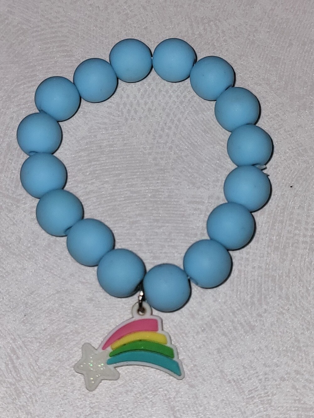 Pastel Blue Beaded Stretch Bracelet with Glitter Rainbow Shooting Star Charm